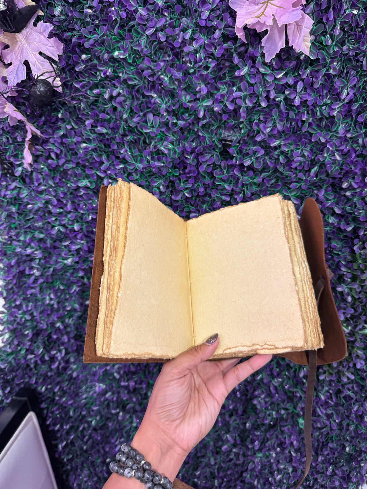 Skeleton key wrap journal open to cream deckle-edge pages.