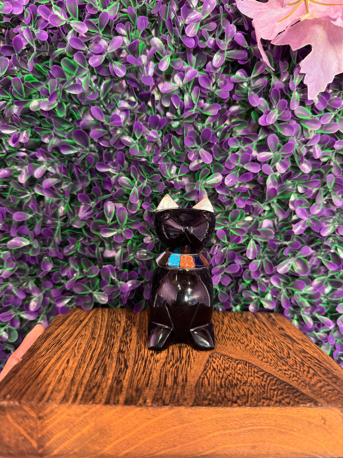 Black Cat Stone Carving — product photo 1. A polished black sitting cat with pointed ears, light ear accents, and a colorful turquoise, orange, and dark-blue inlaid collar.