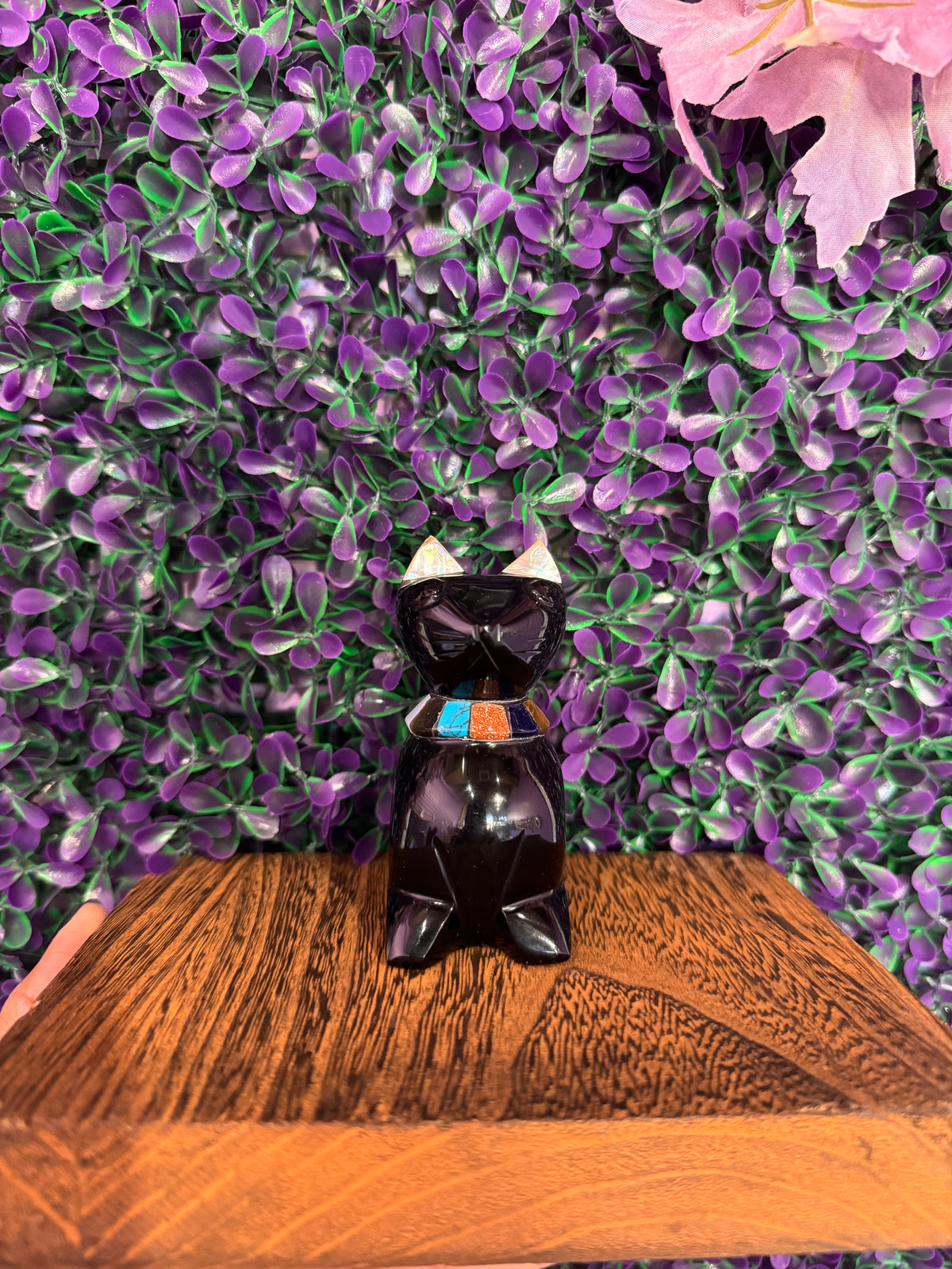 Black Cat Stone Carving — product photo 2. A polished black sitting cat with pointed ears, light ear accents, and a colorful turquoise, orange, and dark-blue inlaid collar.