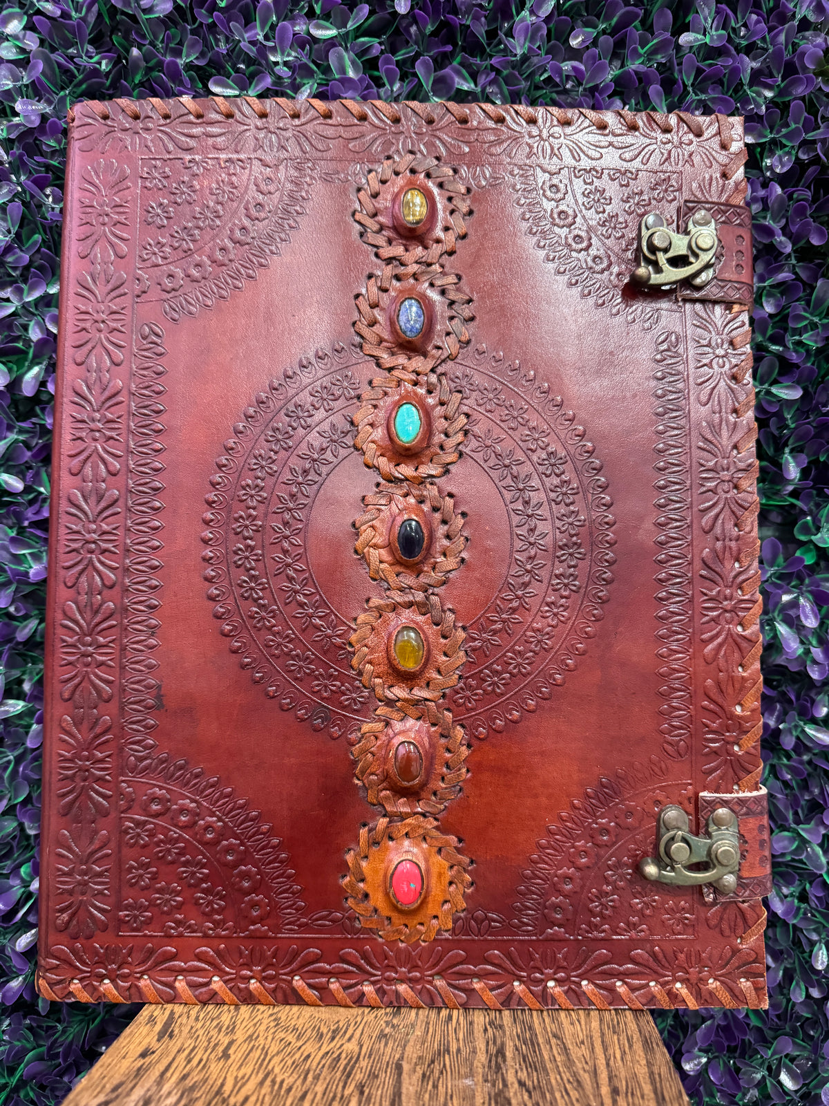 Chakra Mandala Cabochon Journal — product photo 1. A red-brown leather-style journal with an embossed mandala, seven colorful cabochons, and two antique brass-tone clasps.