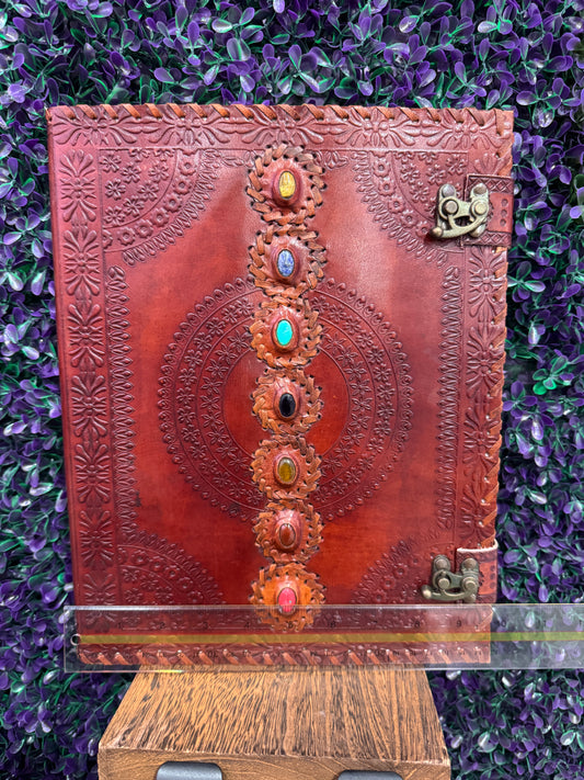 Chakra Mandala Cabochon Journal — product photo 2. A red-brown leather-style journal with an embossed mandala, seven colorful cabochons, and two antique brass-tone clasps.
