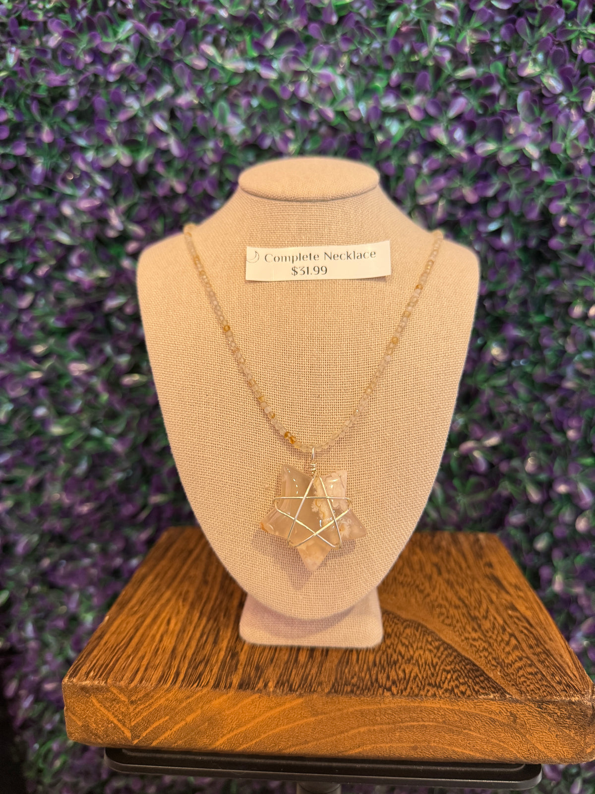 Cream and Peach Star Necklace — product photo 1. A cream, white, and peach star pendant framed in silver-tone wire, paired with a pale faceted bead chain.