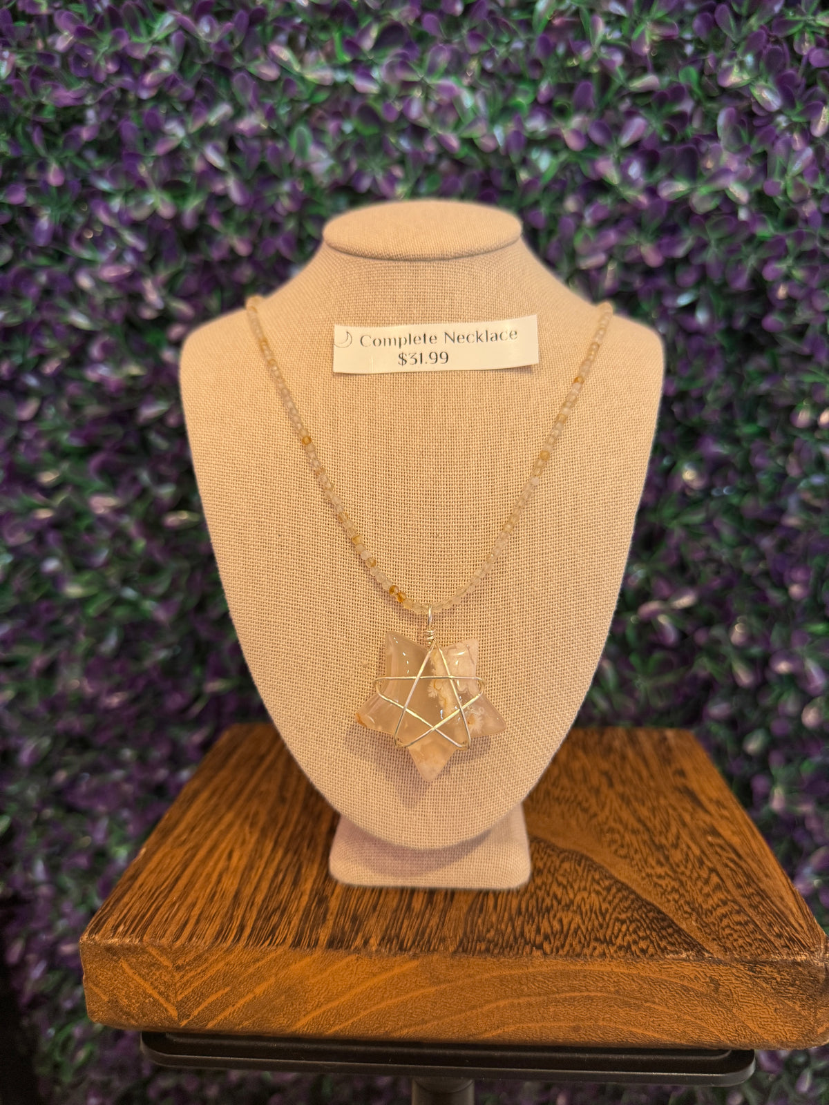 Cream and Peach Star Necklace — product photo 3. A cream, white, and peach star pendant framed in silver-tone wire, paired with a pale faceted bead chain.