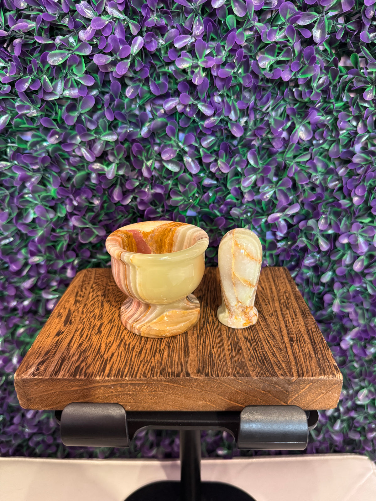 Green onyx mortar and pestle set showing banded cream and green stone.