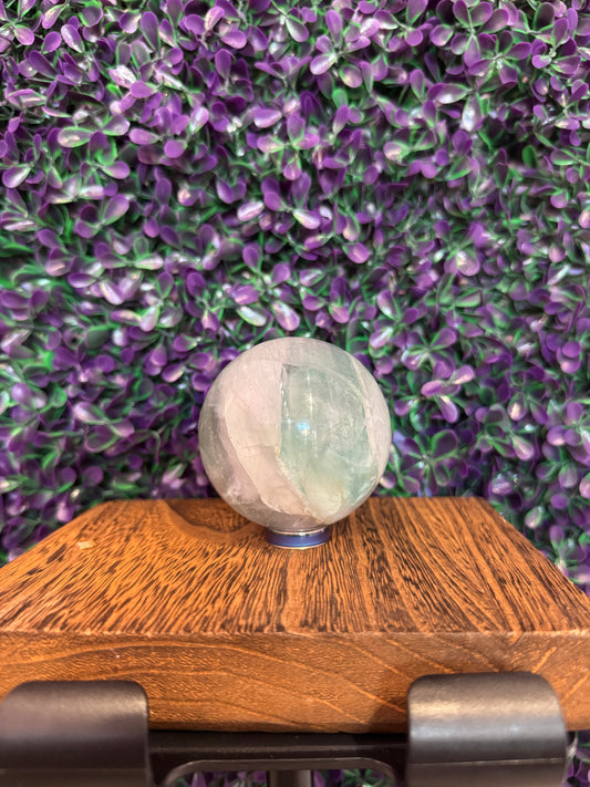 Pale Green and White Sphere — product photo 1. A polished sphere with translucent pale green and frosty white areas and intriguing internal detail.