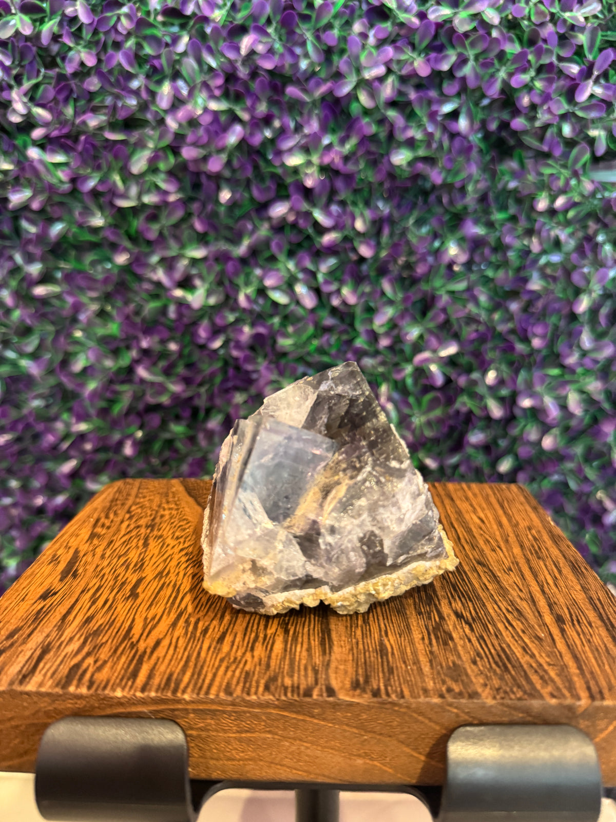 Purple Raw Mineral Specimen — product photo 2. A raw mineral specimen showing clear-to-purple areas, deeper purple zoning, and a pale matrix base.