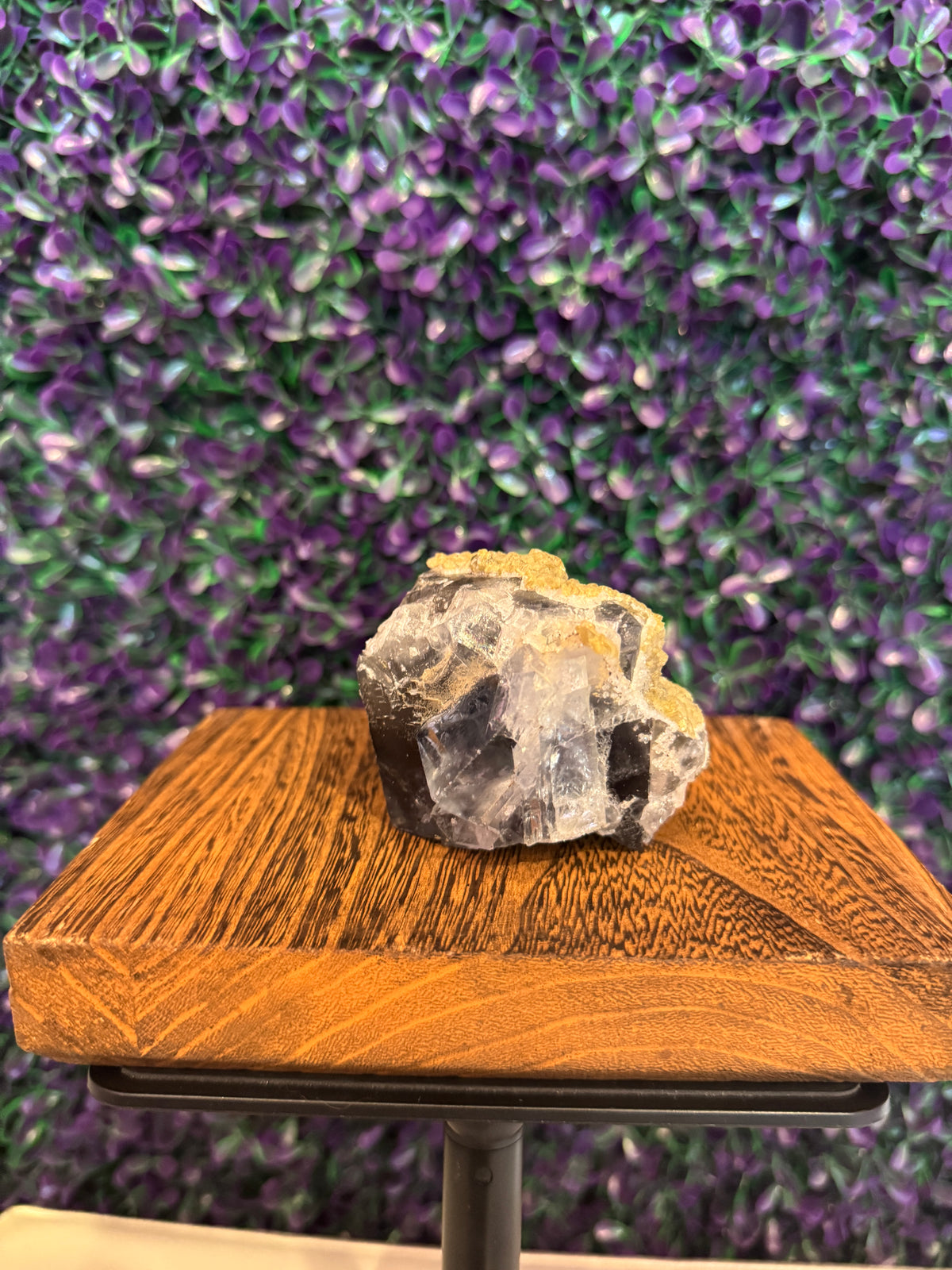 Purple Raw Mineral Specimen — product photo 3. A raw mineral specimen showing clear-to-purple areas, deeper purple zoning, and a pale matrix base.