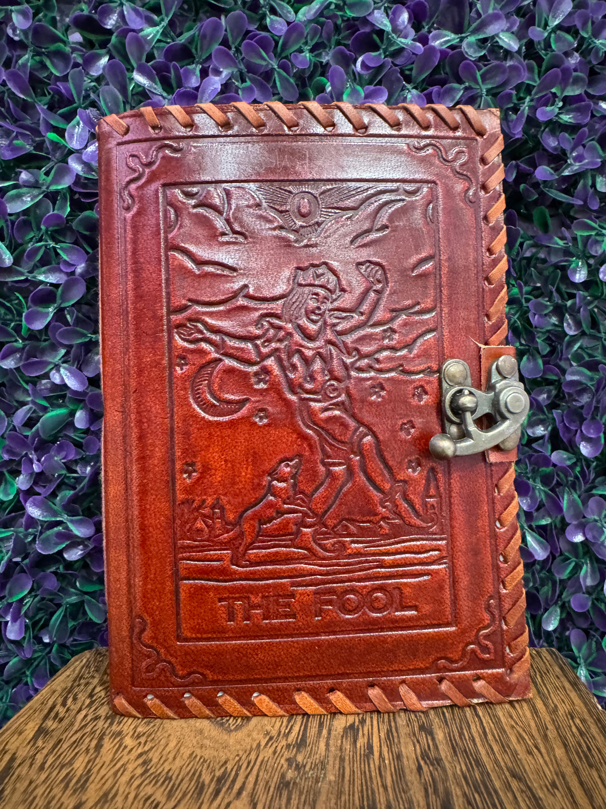 Straight-on view of The Fool tarot journal cover showing the traveler and dog.