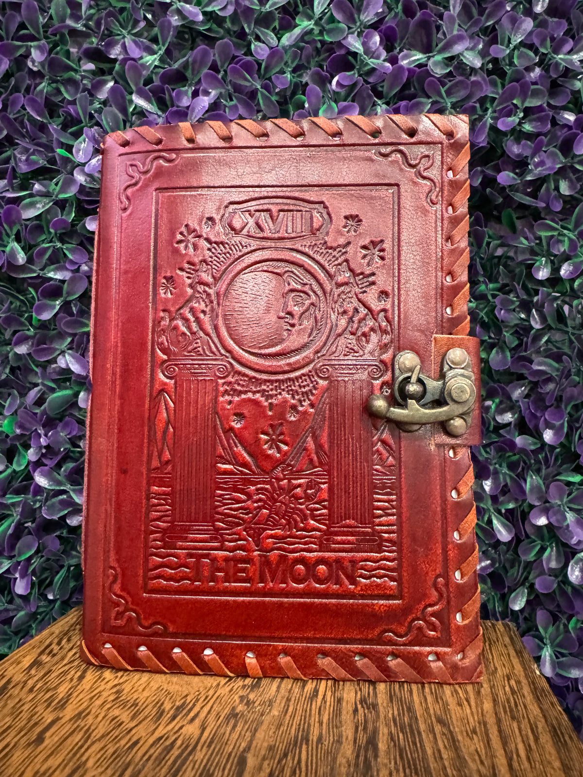 Red-brown embossed journal with The Moon tarot card design and a brass-tone clasp.