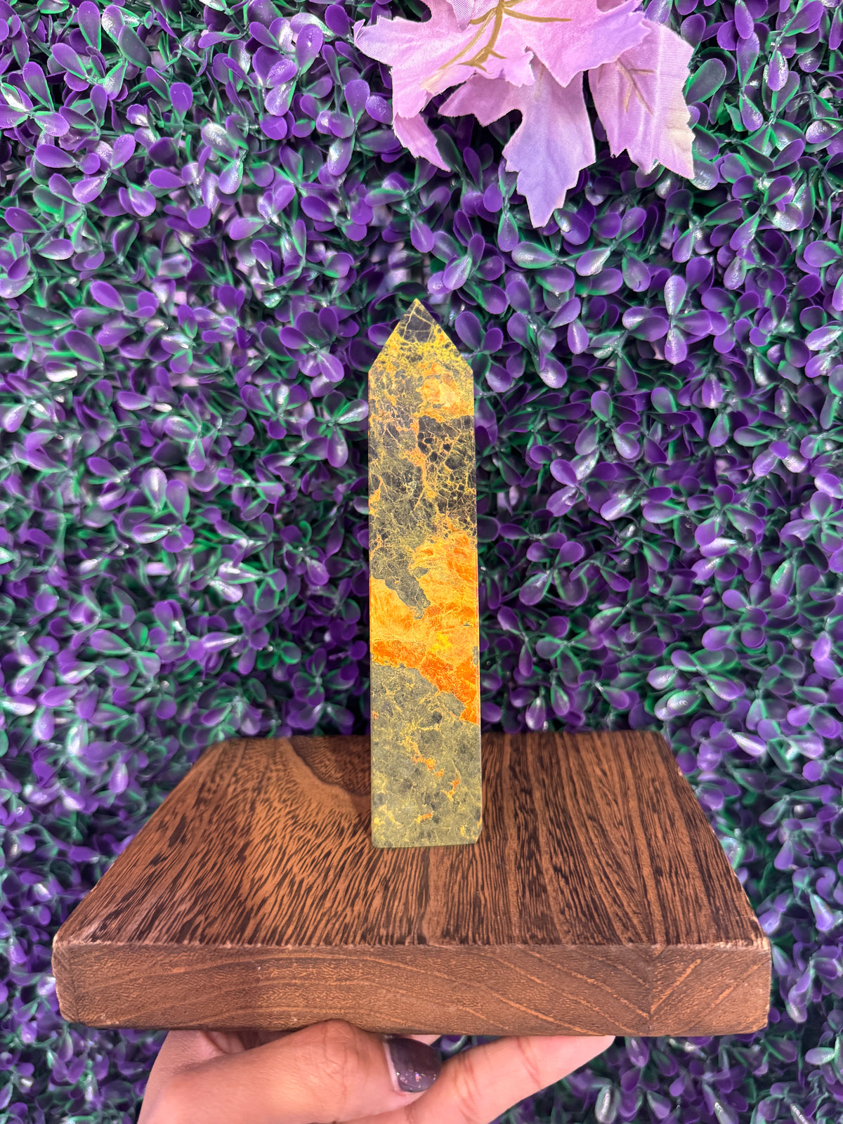 Yellow-Green Stone Tower — product photo 2. A slim, pointed stone tower with yellow-green coloring and contrasting orange-yellow bands.